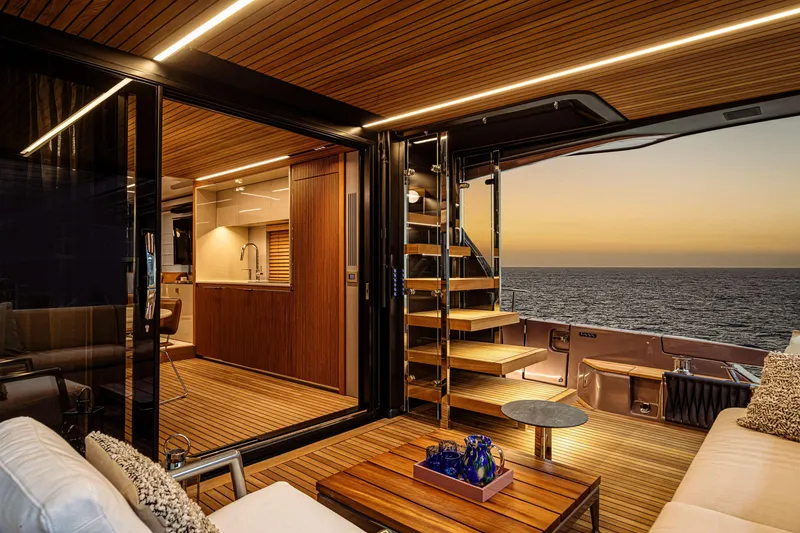 Slide: The Image of Luxurious 2026 Cranchi Sessantadue 62 yacht interior with ocean sunset view. - 11