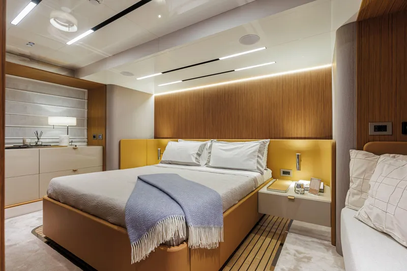 Slide: The Image of Luxurious bedroom interior of 2026 Cranchi Sessantadue 62 yacht with modern design elements. - 12