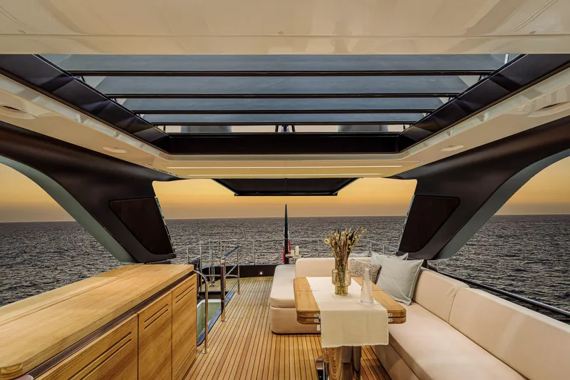 Slide: The Image of Luxurious interior of 2026 Cranchi Sessantadue 62 yacht with ocean view at sunset. - 13