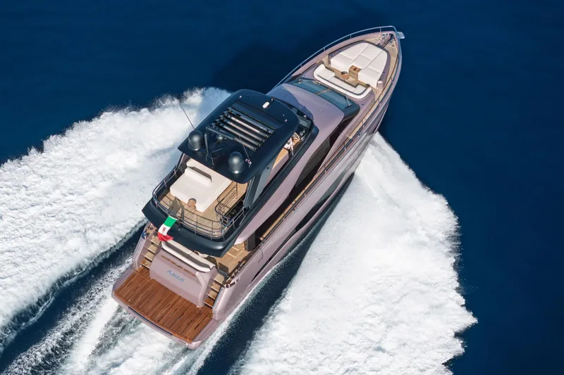 Slide: The Image of 2026 Cranchi Sessantadue 62 yacht cruising on open water, aerial view. - 14