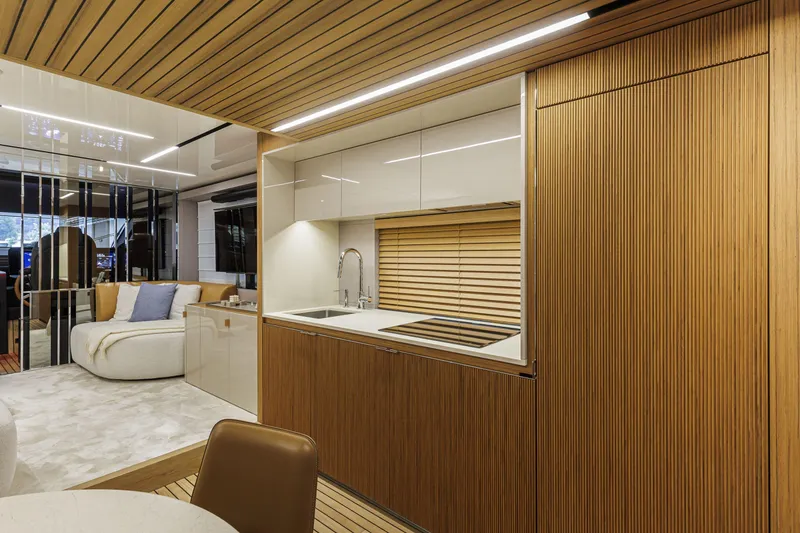 Slide: The Image of Luxurious interior of 2026 Cranchi Sessantadue 62 yacht with modern kitchen and seating area. - 15