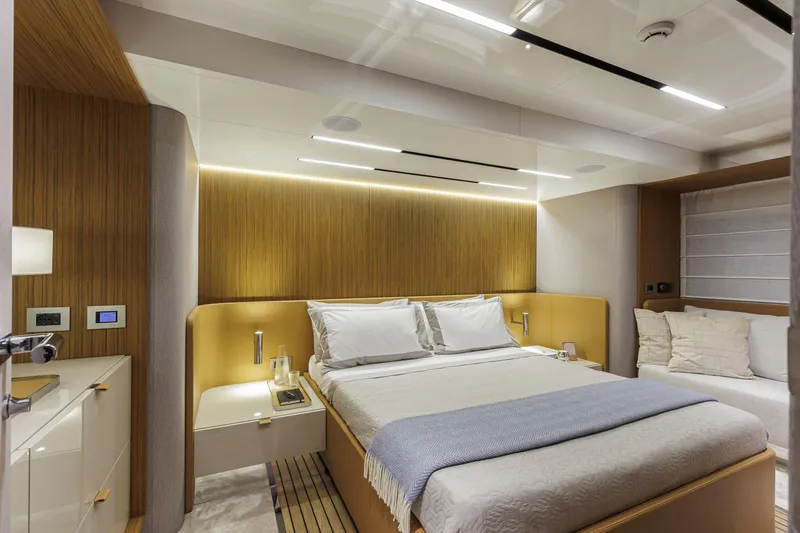 Slide: The Image of Luxurious bedroom interior of 2026 Cranchi Sessantadue 62 yacht, featuring modern design and cozy ambiance. - 19