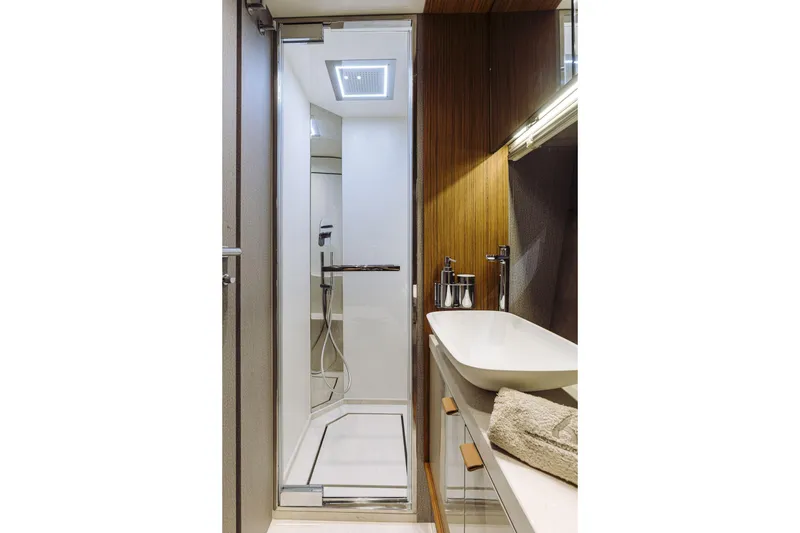 Slide: The Image of Luxurious bathroom in 2026 Cranchi Sessantadue 62 yacht with modern shower and sleek sink. - 21
