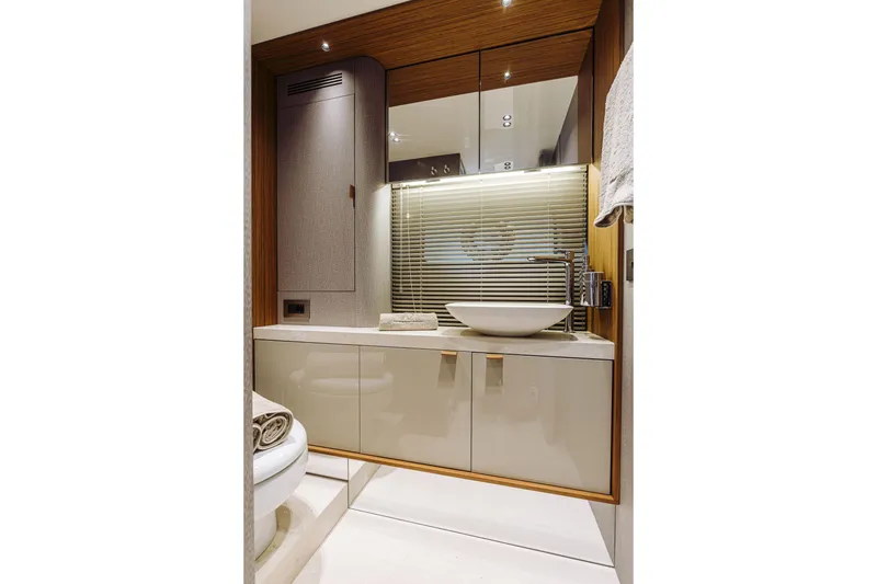 Slide: The Image of Luxurious bathroom interior of 2026 Cranchi Sessantadue 62 yacht with modern sink and cabinetry. - 23