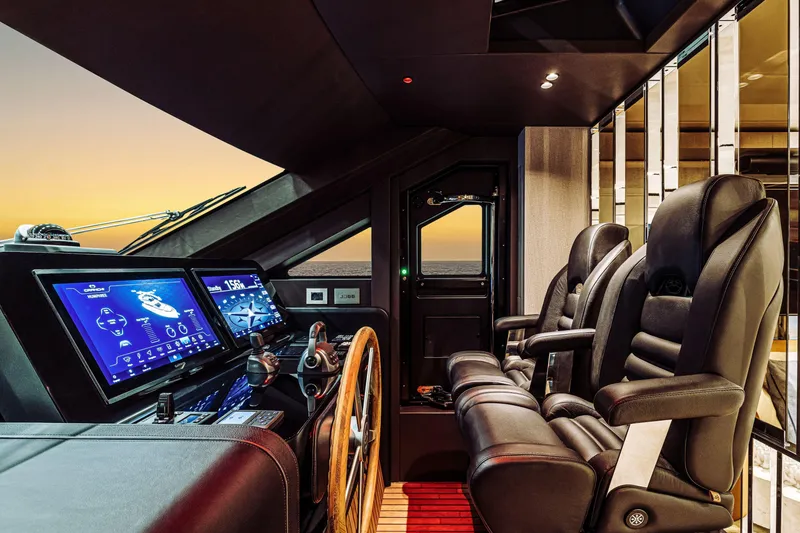 Slide: The Image of Luxurious 2026 Cranchi Sessantadue 62 yacht cockpit with advanced navigation displays at sunset. - 24