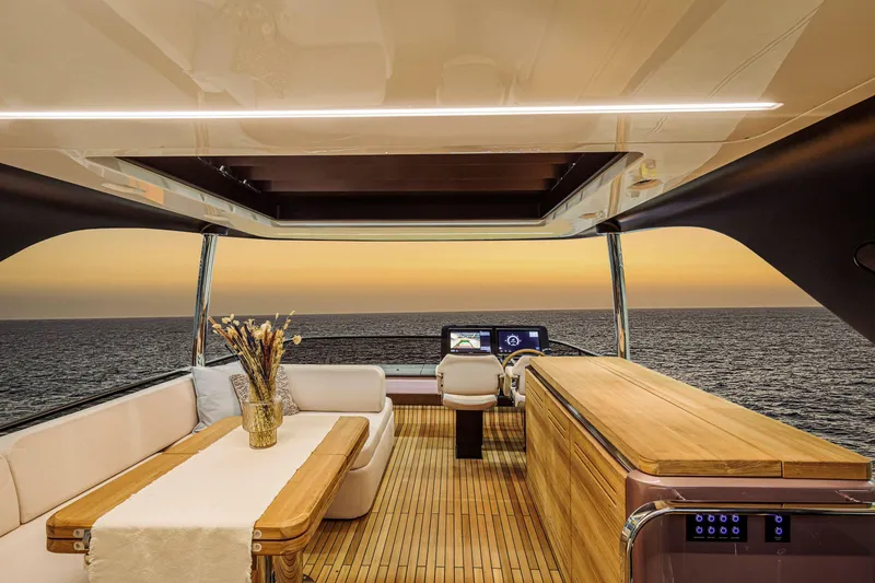 Slide: The Image of Luxurious 2026 Cranchi Sessantadue 62 yacht interior with ocean sunset view. - 28