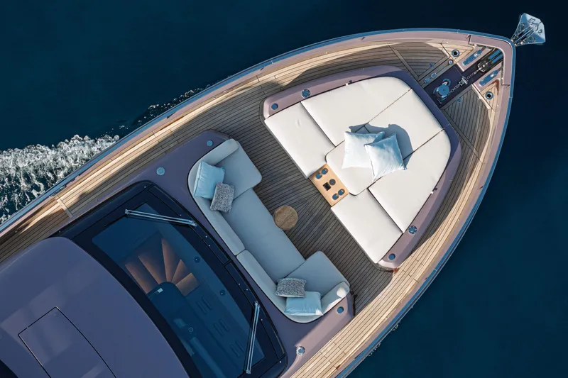Slide: The Image of Luxurious 2026 Cranchi Sessantadue 62 yacht with elegant deck seating and cushions. - 33