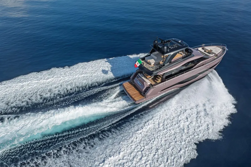 Slide: The Image of 2026 Cranchi Sessantadue 62 yacht cruising on open sea, aerial view. - 35