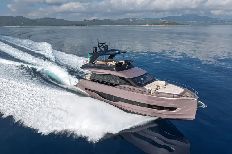 Slide: The Image of 2026 Cranchi Sessantadue 62 yacht cruising on open water, showcasing sleek design and luxury. - 4