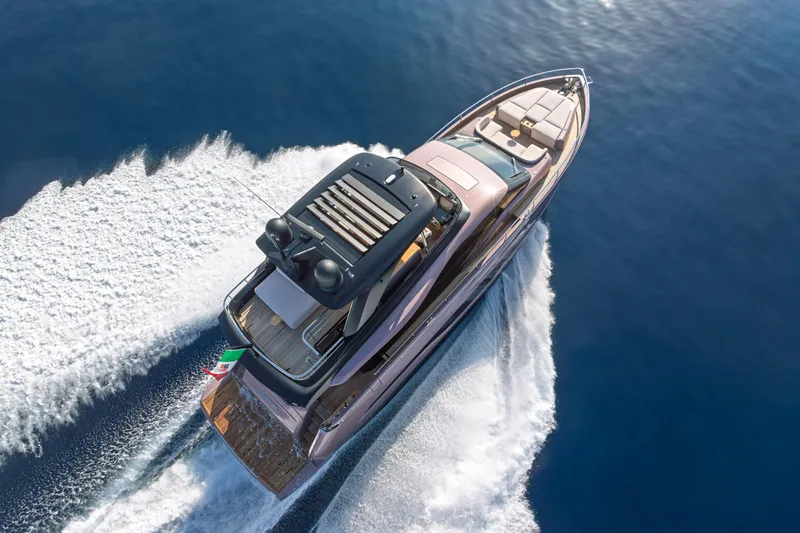 Slide: The Image of 2026 Cranchi Sessantadue 62 yacht cruising on open water, aerial view. - 5