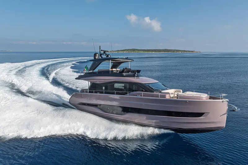 Slide: The Image of 2026 Cranchi Sessantadue 62 yacht cruising on open sea, creating dynamic water trails. - 6