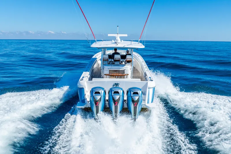 Slide: The Image of 2015 Intrepid 475 Panacea cruising on open ocean with four powerful engines. - 10