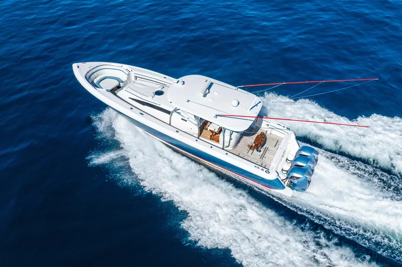 Slide: The Image of 2015 Intrepid 475 Panacea cruising on open blue waters, aerial view. - 11