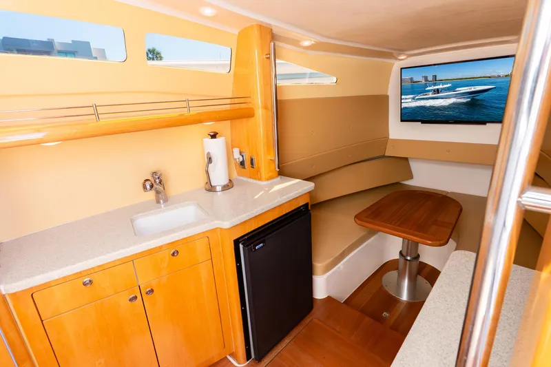 Slide: The Image of Luxurious interior of 2015 Intrepid 475 Panacea yacht with kitchenette and seating area. - 18