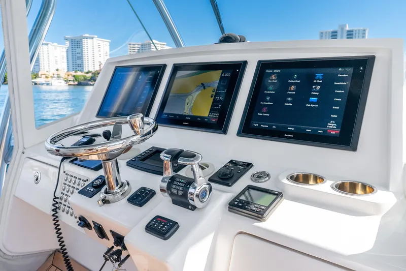 Slide: The Image of Helm of 2015 Intrepid 475 Panacea with advanced navigation displays and controls. - 21