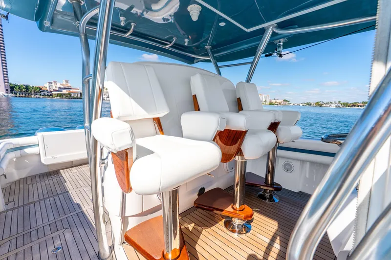 Slide: The Image of Luxury seating on 2015 Intrepid 475 Panacea boat, with ocean view and sleek design. - 22