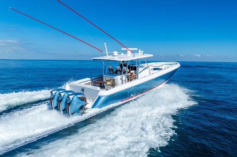 Slide: The Image of 2015 Intrepid 475 Panacea cruising on open blue ocean waters. - 3