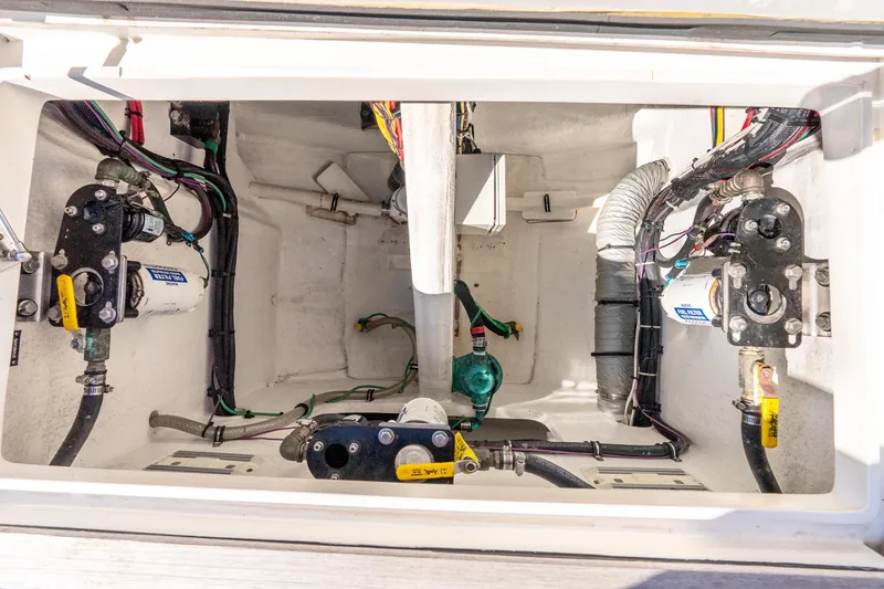 Slide: The Image of Engine compartment of a 2015 Intrepid 475 Panacea, showcasing mechanical components and wiring. - 30