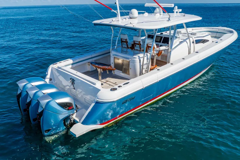 Slide: The Image of 2015 Intrepid 475 Panacea boat with triple outboard engines on open sea. - 4