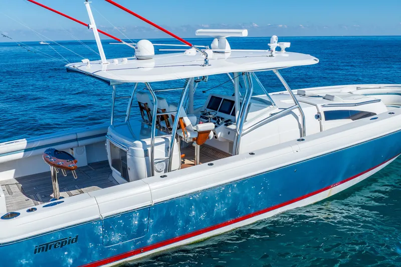 Slide: The Image of 2015 Intrepid 475 Panacea boat on clear blue ocean water. - 7