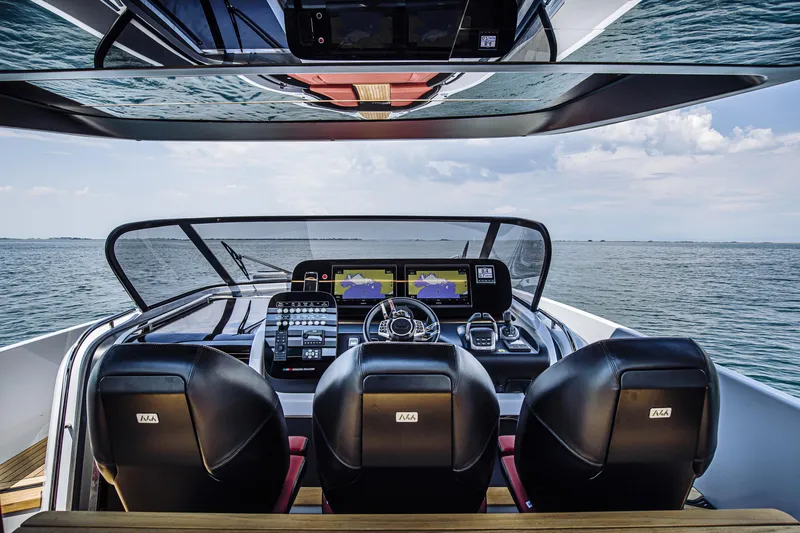 Slide: The Image of 2026 Cranchi A46 Luxury Tender cockpit with advanced navigation system on open water. - 30