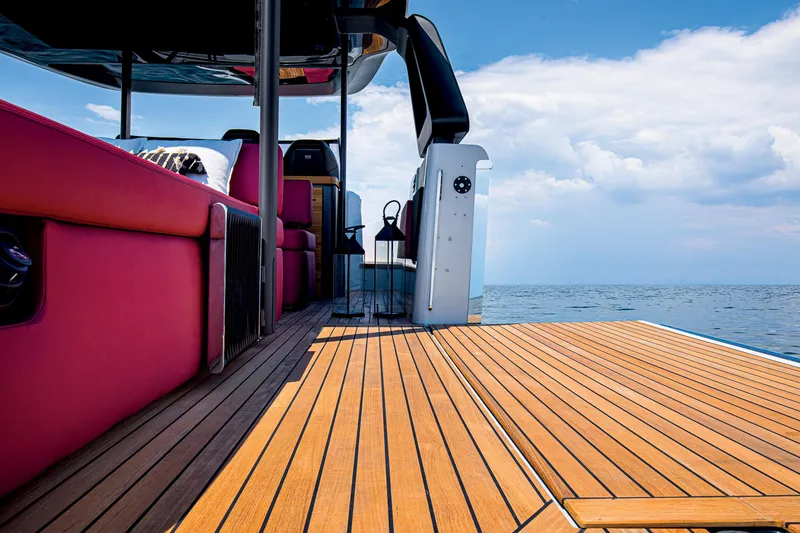 Slide: The Image of 2026 Cranchi A46 Luxury Tender with red seating and wooden deck on open water. - 42