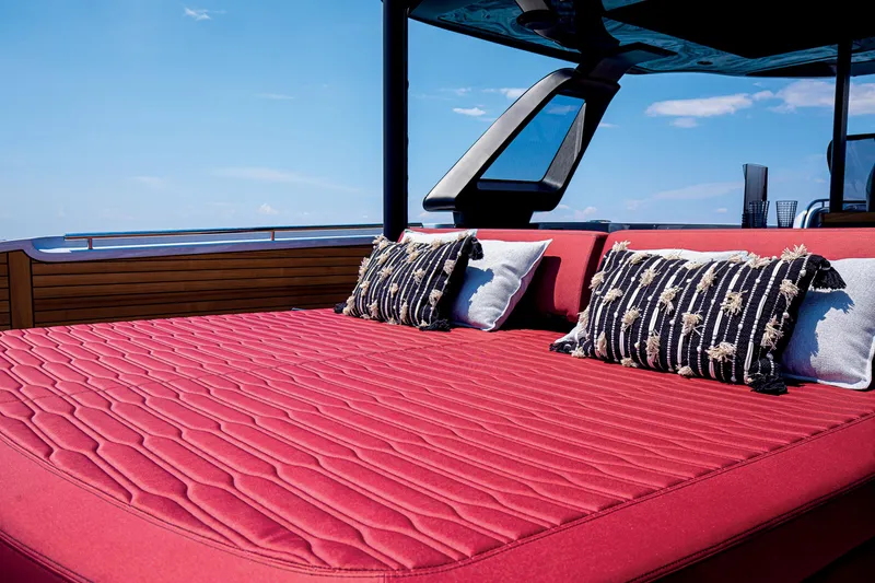 Slide: The Image of Luxurious red sunbed on 2026 Cranchi A46 Luxury Tender yacht with decorative pillows. - 45