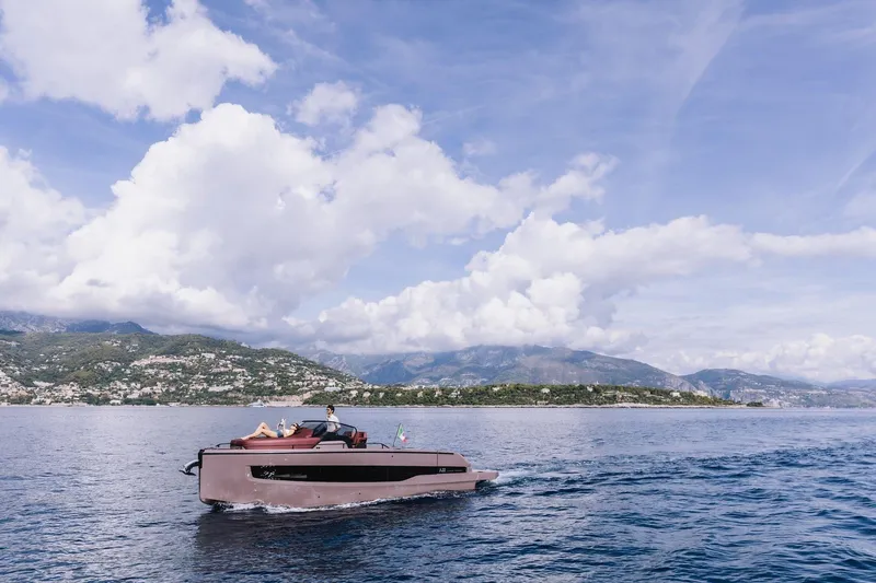 Slide: The Image of 2026 Cranchi A32 Luxury Tender cruising on scenic coastal waters. - 28