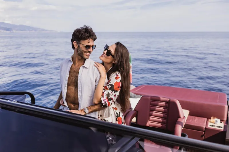 Slide: The Image of Couple enjoying a sunny day on a 2026 Cranchi A32 Luxury Tender yacht. - 32