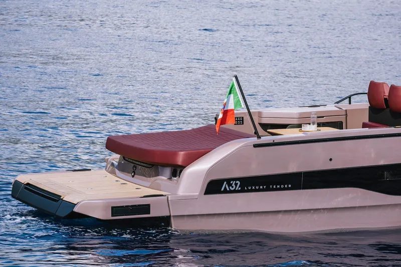 Slide: The Image of 2026 Cranchi A32 Luxury Tender on water, featuring sleek design and Italian flag. - 4