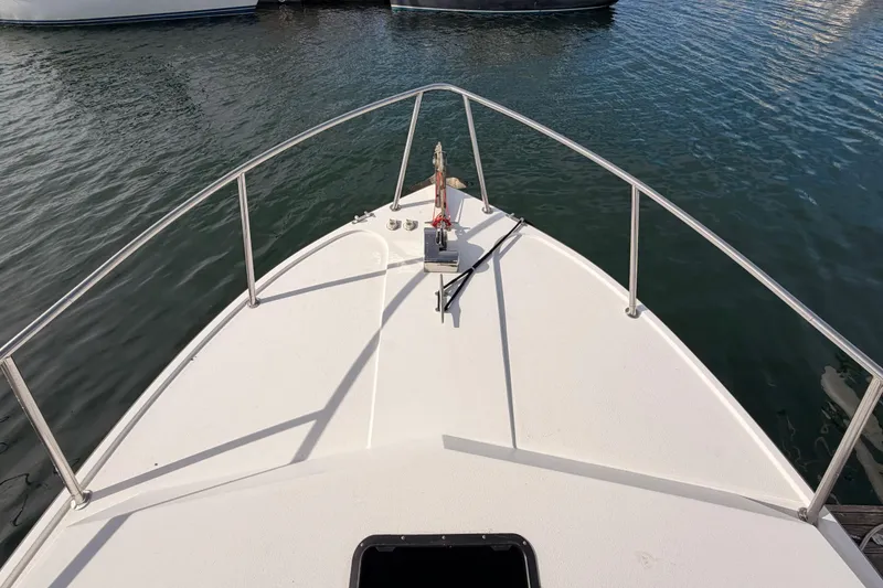 Slide: The Image of Bow view of 2002 Eastern Downeast 35 boat on calm water. - 17