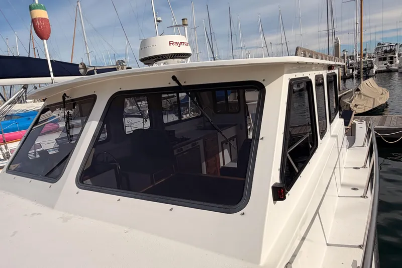Slide: The Image of 2002 Eastern Downeast 35 boat docked at marina with radar equipment. - 20