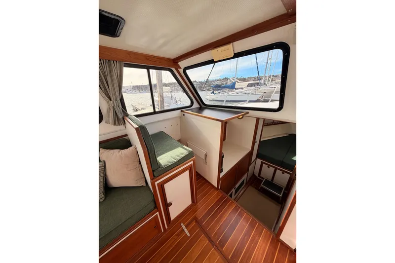 Slide: The Image of Interior of 2002 Eastern Downeast 35 boat with wood flooring and seating area. - 28