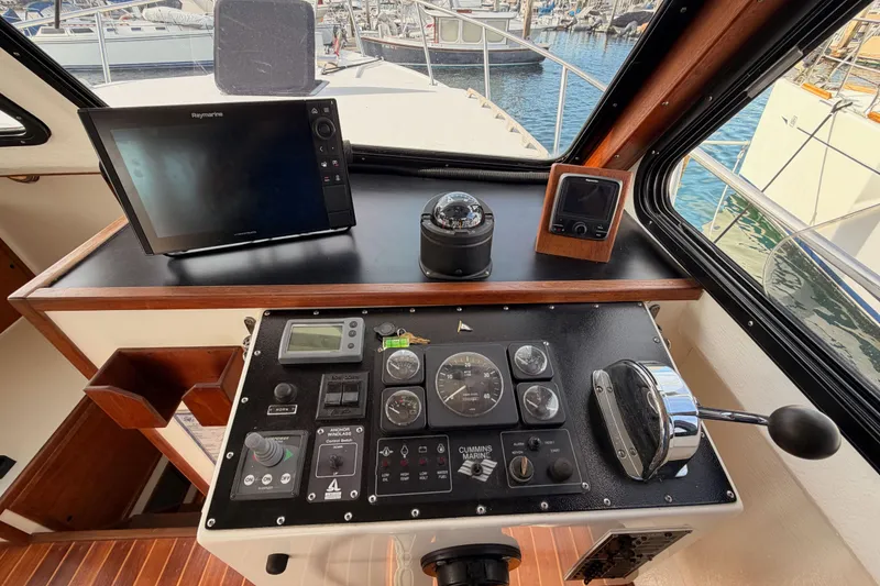 Slide: The Image of Helm of 2002 Eastern Downeast 35 boat with navigation equipment and controls. - 34