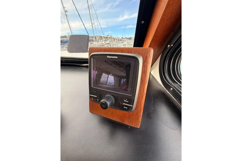 Slide: The Image of Raymarine navigation system on 2002 Eastern Downeast 35 boat dashboard. - 38