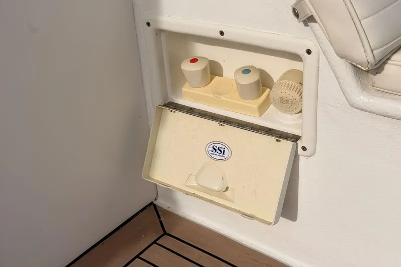 Slide: The Image of Boat shower controls on a 2002 Eastern Downeast 35, featuring SSI Marine Plastics. - 62