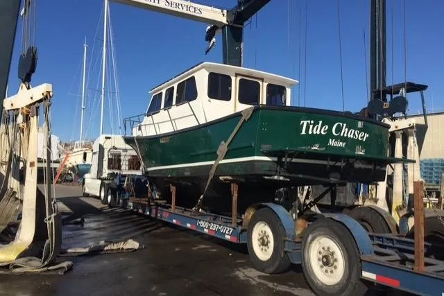 Slide: The Image of 2002 Eastern Downeast 35 boat "Tide Chaser" on trailer at marina. - 69