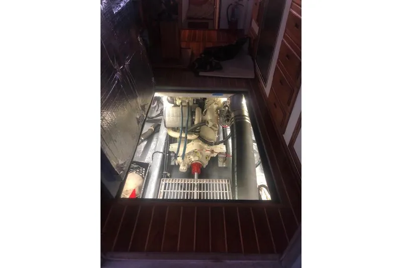 Slide: The Image of Engine compartment of a 2002 Eastern Downeast 35 boat, showcasing mechanical components. - 73