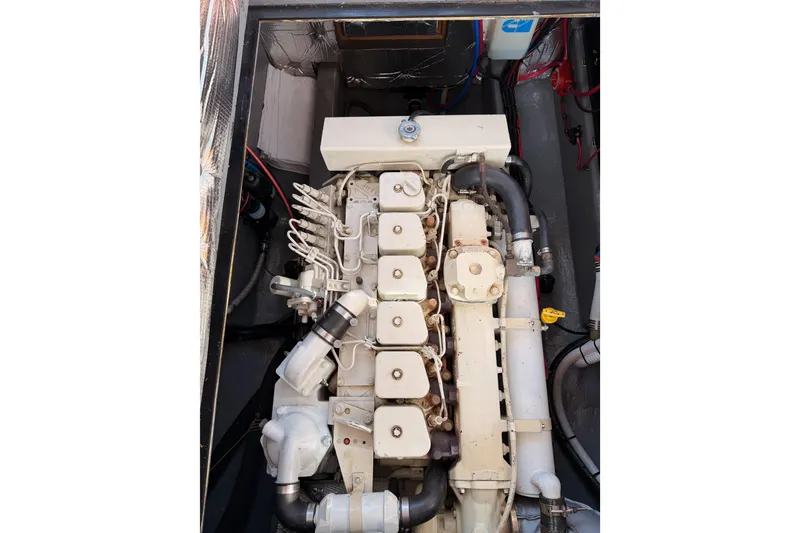 Slide: The Image of Engine compartment of a 2002 Eastern Downeast 35 boat, showcasing mechanical components. - 74