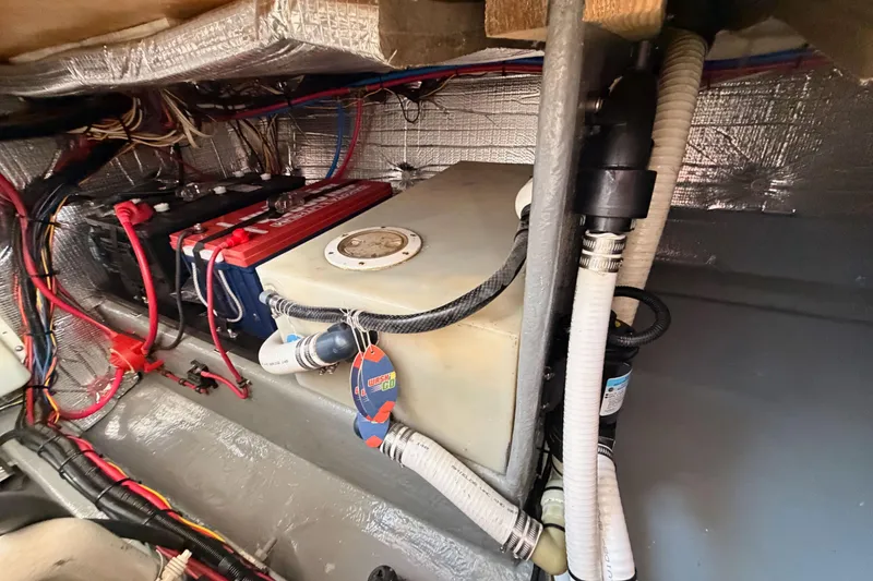 Slide: The Image of Engine compartment of a 2002 Eastern Downeast 35 boat with wiring and components. - 76