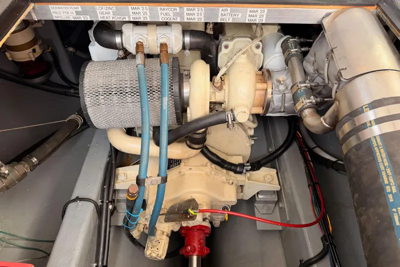 Slide: The Image of Engine compartment of a 2002 Eastern Downeast 35 boat, showcasing detailed components. - 80