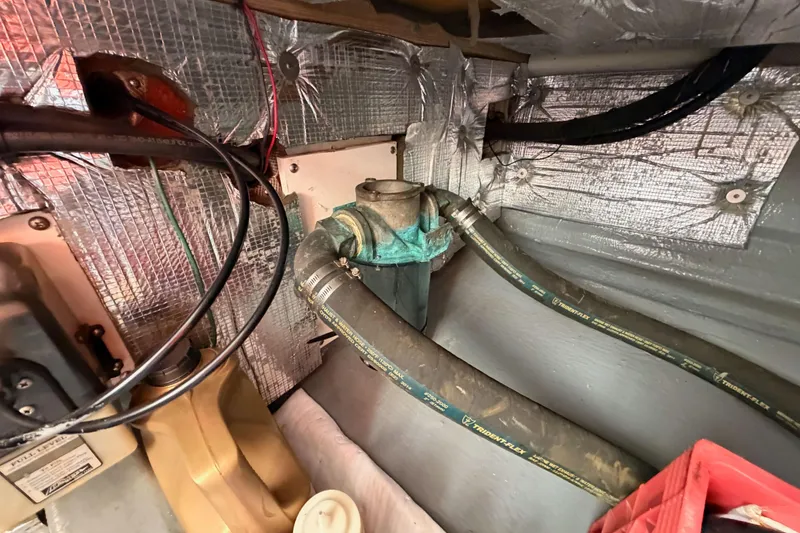 Slide: The Image of Engine compartment of a 2002 Eastern Downeast 35 with hoses and insulation. - 84