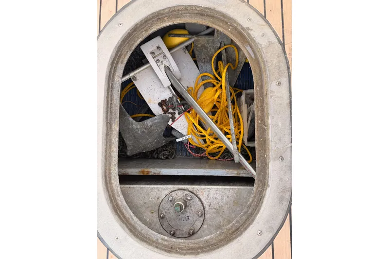 Slide: The Image of Anchor locker of 2002 Eastern Downeast 35 boat with ropes and chains. - 90