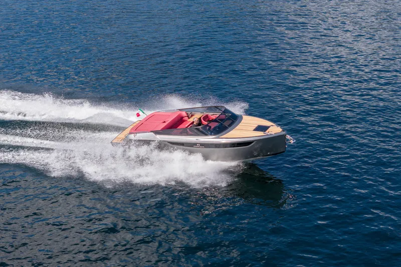 Slide: The Image of 2026 Cranchi E26 Classic speedboat cruising on open water. - 3