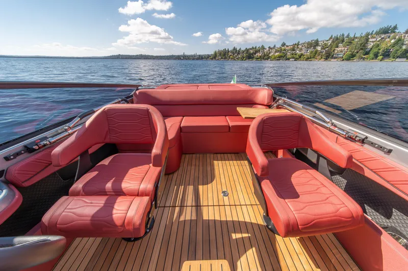 Slide: The Image of Luxurious 2026 Cranchi E26 Classic boat interior with red leather seats and wooden deck. - 35