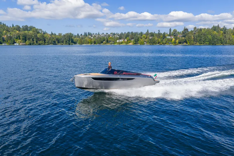 Slide: The Image of 2026 Cranchi E26 Classic cruising on a serene lake under a clear blue sky. - 39