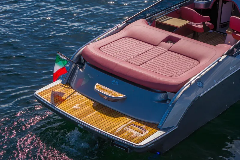 Slide: The Image of 2026 Cranchi E26 Classic yacht with elegant deck and Italian flag on water. - 43