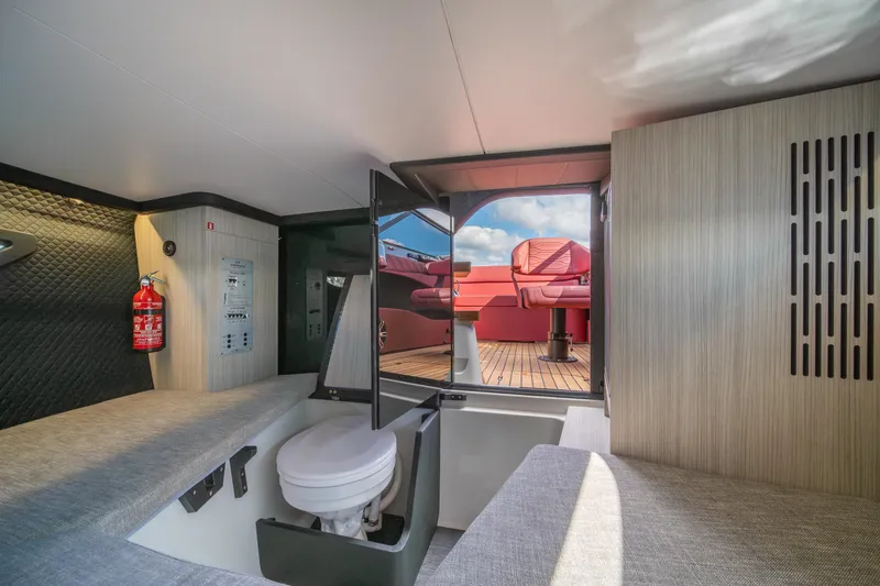 Slide: The Image of Interior of 2026 Cranchi E26 Classic yacht, featuring modern design and comfortable seating. - 7