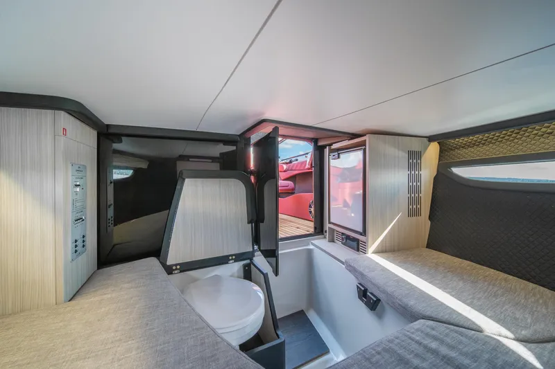 Slide: The Image of Interior of 2026 Cranchi E26 Classic boat, featuring modern design and compact amenities. - 8
