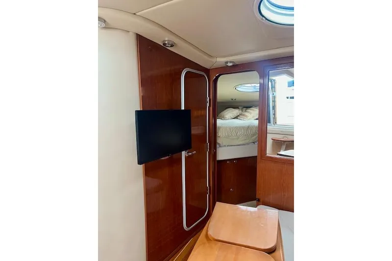 Slide: The Image of Interior of 2006 Regal Commodore 3560 IO yacht with TV and cozy cabin. - 22